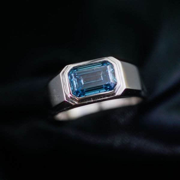 Emerald Cut Fancy Blue Bezel Ring (2) Emerald Cut Fancy Blue Bezel Ring (2)