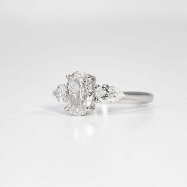 Oval Brilliant & Pear Three-Stone Diamond Ring (3) Oval Brilliant & Pear Three-Stone Diamond Ring (3)