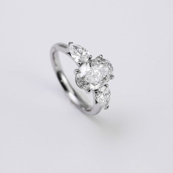 Oval Brilliant & Pear Three-Stone Diamond Ring Oval Brilliant & Pear Three-Stone Diamond Ring